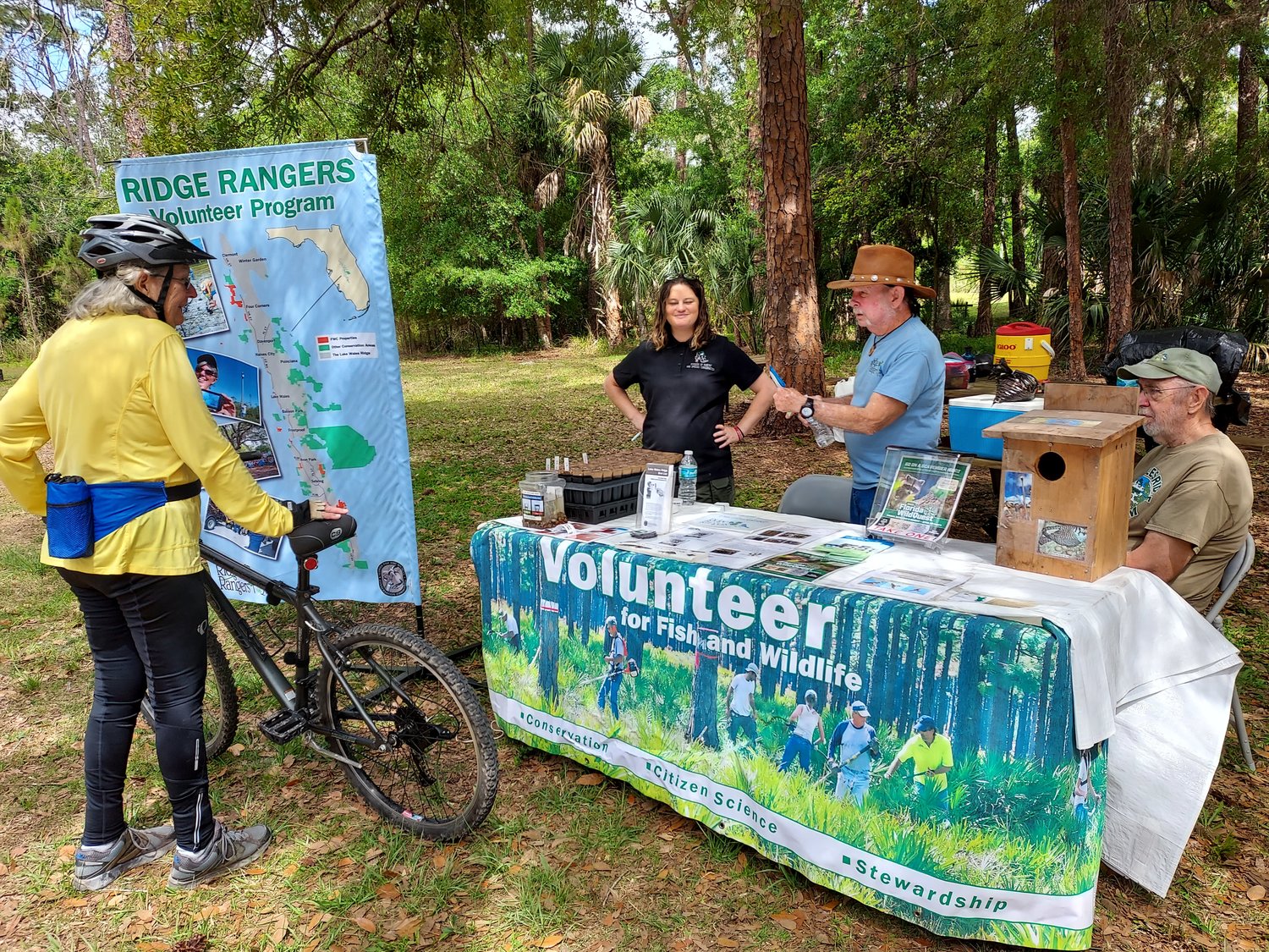 Bicyclist inquires about FWC Ridge Ranger Resource Management Volunteer Program at last year’s festival. [Courtesy photo]